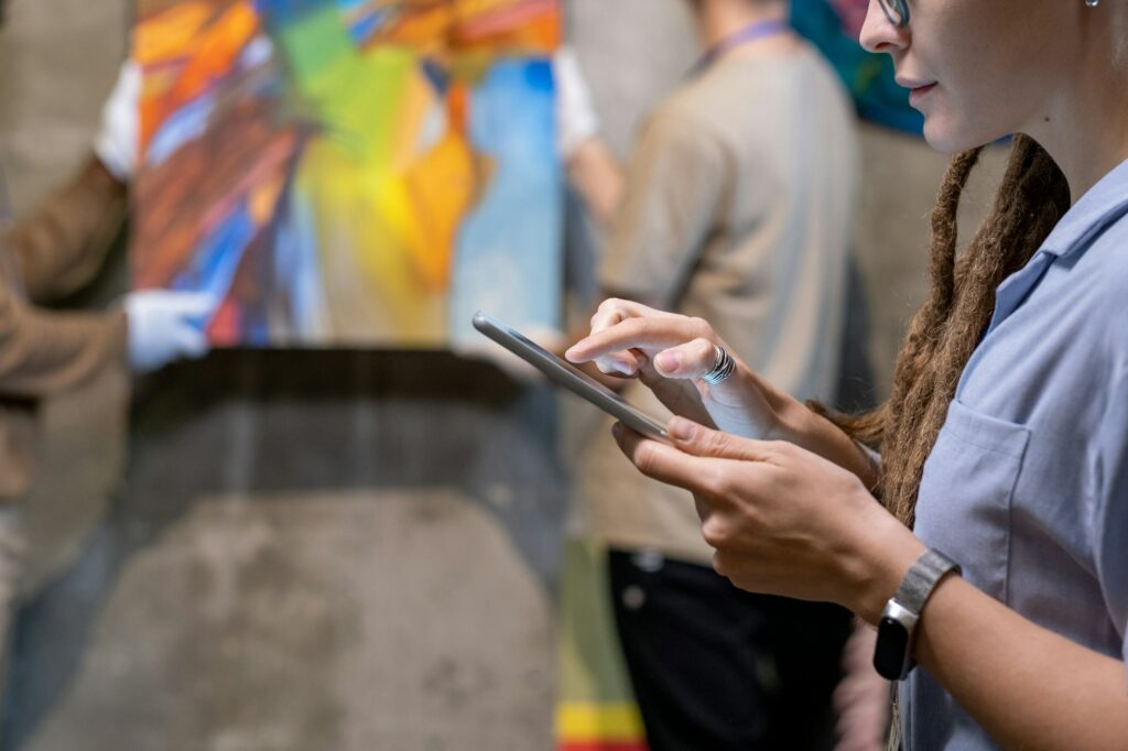 Woman using tablet pc in art gallery